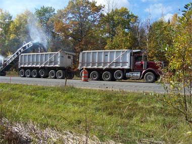 A Cold Milling Machine removes old asphalt from the road